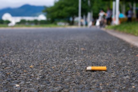 Photo for Cigarette littered on sidewalk close up - Royalty Free Image