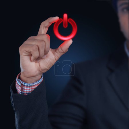 Photo for Man showing the power button - Royalty Free Image