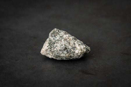 Photo for Small piece of the hardest kind of granite bed rock with its typical texture and color - Royalty Free Image