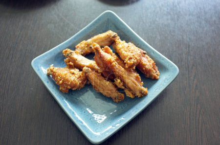 Photo for Salt fried chicken wings on the plate - Royalty Free Image