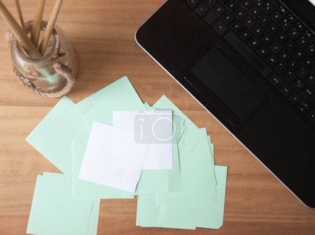 Photo for Tabletop Laptop and Note Papers - Royalty Free Image
