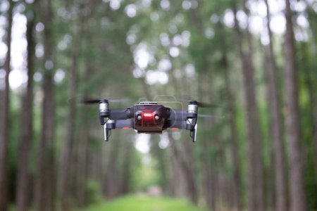 Photo for Drone quad copter above the ground in a park - Royalty Free Image