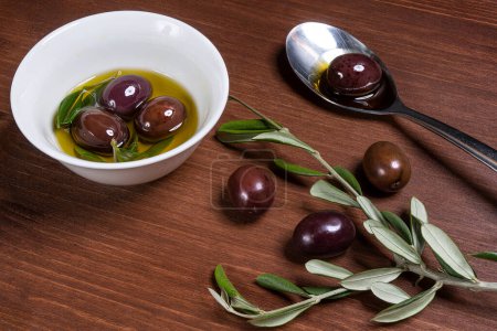 Photo for Olive oil and olives on table - Royalty Free Image