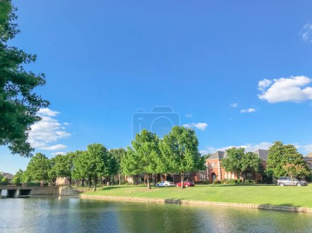 Photo for Beautiful riverside residential neighborhood in suburbs Dallas under blue cloud sky - Royalty Free Image