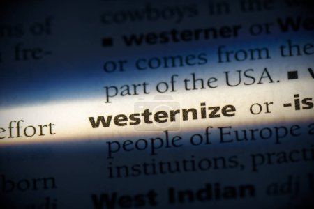 Photo for Westernize word, highlighted in dictionary, close up view - Royalty Free Image