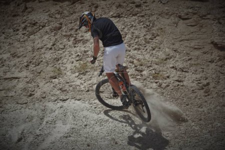 Photo for Man on mountain cycling competition - Royalty Free Image