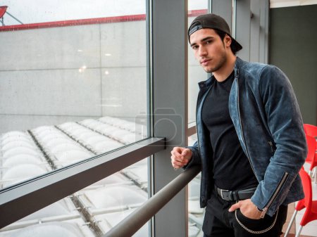 Photo for Attractive young man indoors wearing a denim jacket - Royalty Free Image