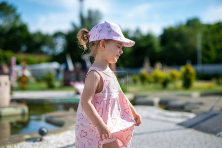 Photo for Little girl spending fantastic time on playground - Royalty Free Image