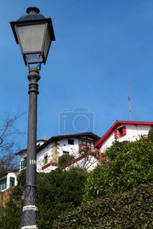 Photo for Getxo, Spain - 17 February 2013: Typical houses and a lantern - Royalty Free Image