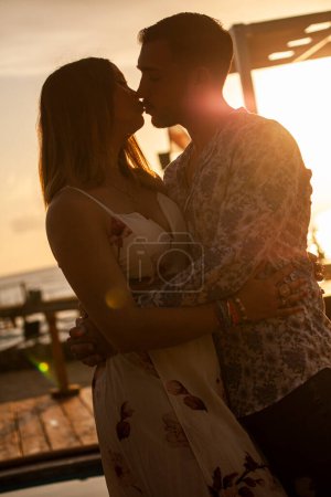 Photo for Couple kissing at sunset - Royalty Free Image