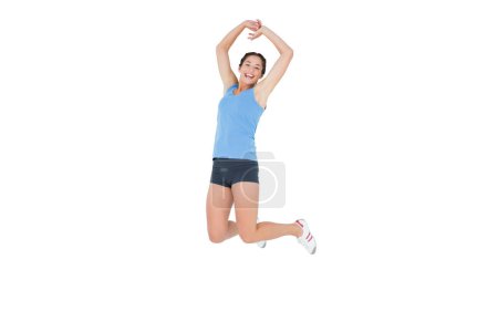 Photo for Sporty woman jumping over white background - Royalty Free Image