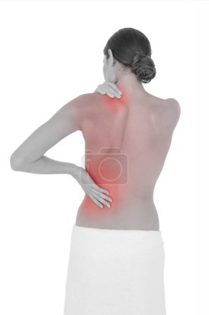 Foto de Vista trasera de una mujer en forma de topless con dolor en el hombro - Imagen libre de derechos
