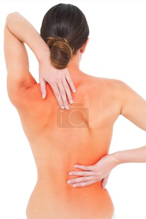 Foto de "Vista trasera de una mujer joven en topless en forma con dolor de espalda
" - Imagen libre de derechos