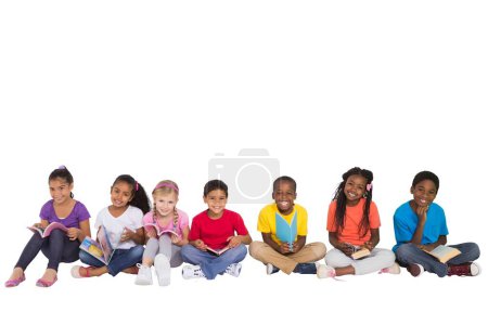 Photo for Composite image of schoolchildren sitting together - Royalty Free Image
