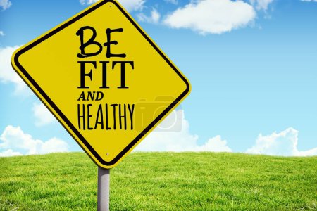 Photo for Composite image of healthy and fit message on a sign - Royalty Free Image
