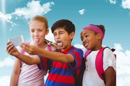Photo for Composite image of schoolchildren grimacing and taking a picture - Royalty Free Image