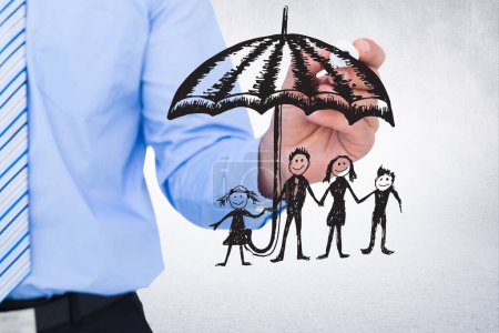 Photo for Digital composite of business team holding umbrella with drawings - Royalty Free Image