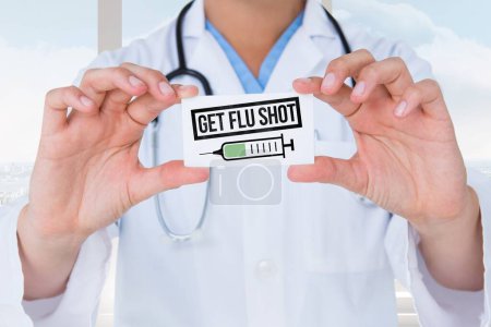 Foto de Médico sosteniendo un cartel con la vacuna contra la gripe - Imagen libre de derechos
