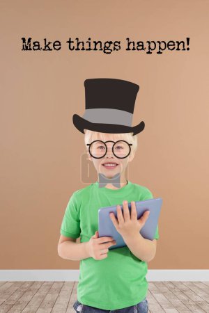 Photo for Young boy holding a digital tablet - Royalty Free Image