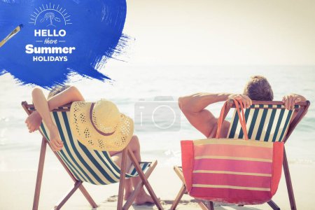 Photo for Couple lying on a sunlounger - Royalty Free Image