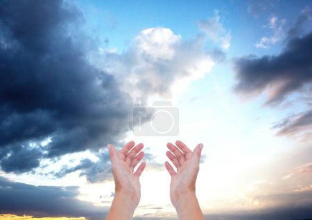 Photo for Rising hands against sky background - Royalty Free Image