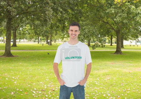 Photo for Smiling man volunteer posing in the park - Royalty Free Image