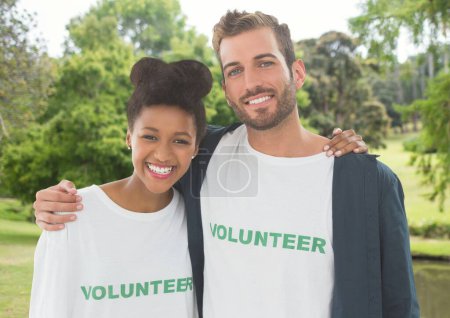 Photo for "Happy couple of volunteer against park background " - Royalty Free Image
