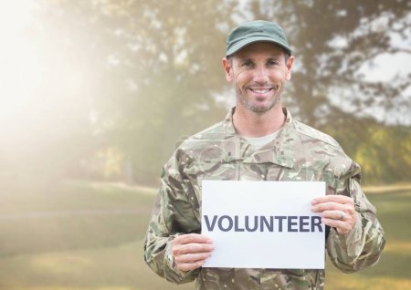 Photo for Digital composite of volunteer holding sign - Royalty Free Image