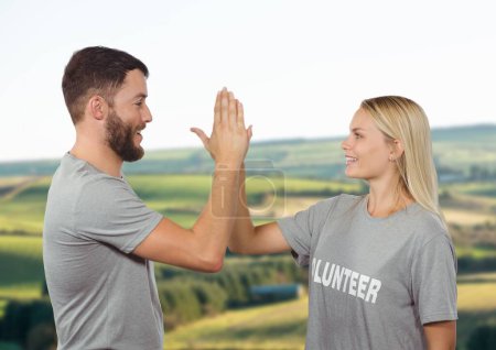 Photo for Couple volunteers high five - Royalty Free Image