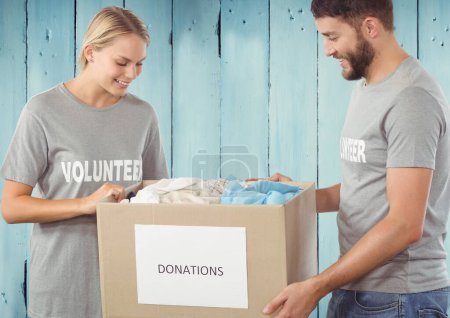 Photo for Digital composite of volunteers holding donation boxes - Royalty Free Image