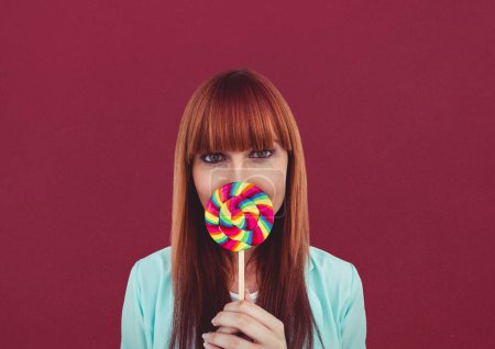 Photo for Digital composite of woman having a lolly - Royalty Free Image