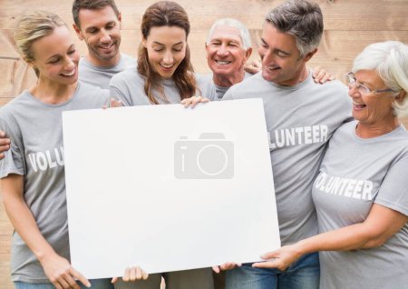 Téléchargez les photos : Composite de groupe de bénévoles tenant signe - en image libre de droit