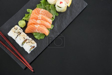 Photo for Sushi with chopsticks on table - Royalty Free Image