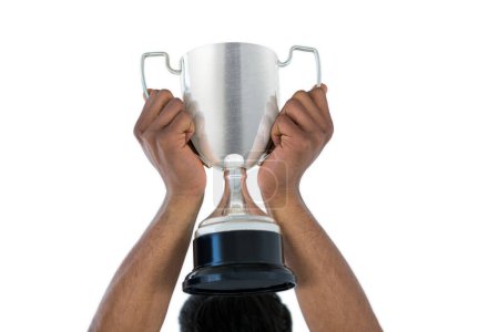 Photo for Hand of businessman lifting a trophy - Royalty Free Image