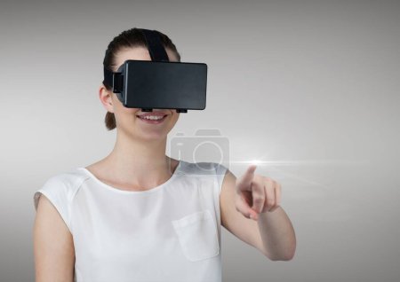 Photo for Woman experiencing virtual reality headset - Royalty Free Image