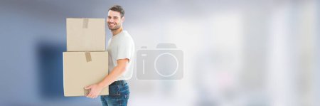 Photo for Man with boxes in front of blurred background - Royalty Free Image