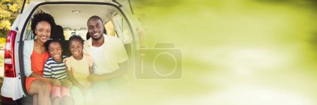 Photo for Family in back of car with blurry green transition - Royalty Free Image