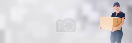 Photo for Delivery Courier with box in front of blurred background - Royalty Free Image