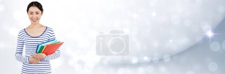 Photo for Woman holding files and folders with blurred sparkling background - Royalty Free Image