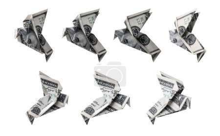 Foto de Juego en origami de billetes de cien dólares en forma de pájaro en diferentes ángulos - Imagen libre de derechos