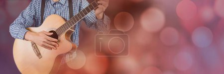 Photo for Man playing guitar with pink lights - Royalty Free Image