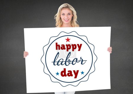 Photo for Business woman holding a Labor Day card against grey background - Royalty Free Image