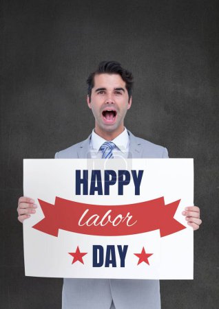 Photo for Surprised business man holding a Labor Day card - Royalty Free Image