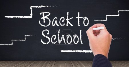 Photo for Hand writing with chalk Back to school text with chalk steps on blackboard - Royalty Free Image