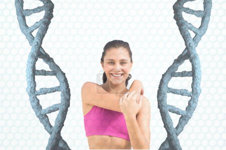 Photo for Happy fitness woman standing with 3D DNA strand - Royalty Free Image