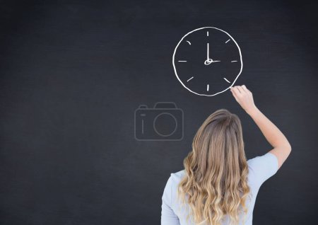 Photo for Woman drawing clock on blackboard - Royalty Free Image