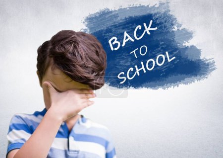Photo for Back to school text with upset disappointed boy - Royalty Free Image