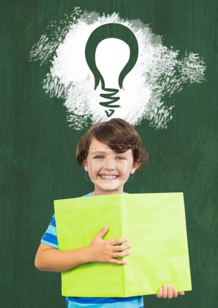 Photo for Boy with book and light bulb idea and blackboard - Royalty Free Image