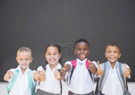 Photo for Kids with thumbs up in front of blackboard - Royalty Free Image