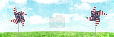 Téléchargez les photos : USA attrape-vent devant l'herbe et le ciel - en image libre de droit
